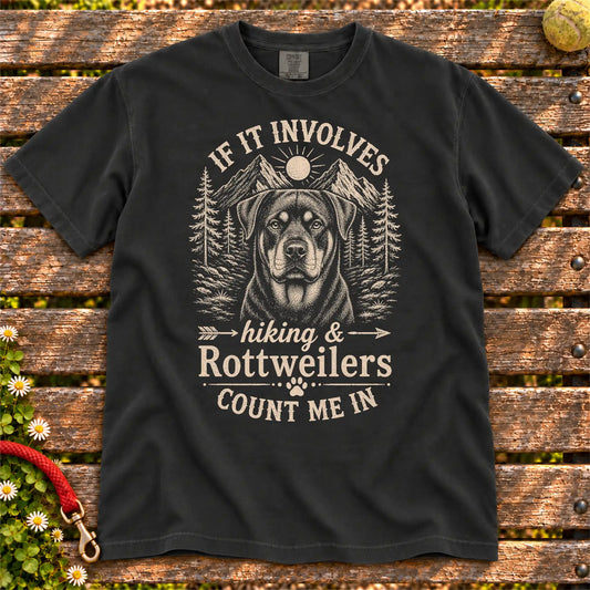 Hiking and Rottweilers design on a Black Comfort Colors T-shirt, shown flat
