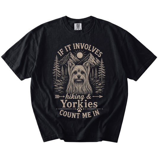 Yorkie hiking design with mountain scenery on a Black Comfort Colors® T-shirt
