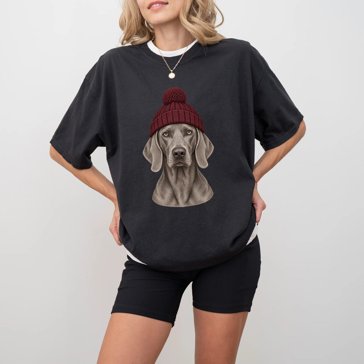 Woman wearing a Black Weimaraner hipster T-shirt with a maroon-beanie dog portrait