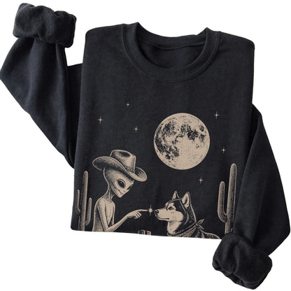 Black crewneck sweatshirt featuring Husky Cowboy and Alien, folded presentation