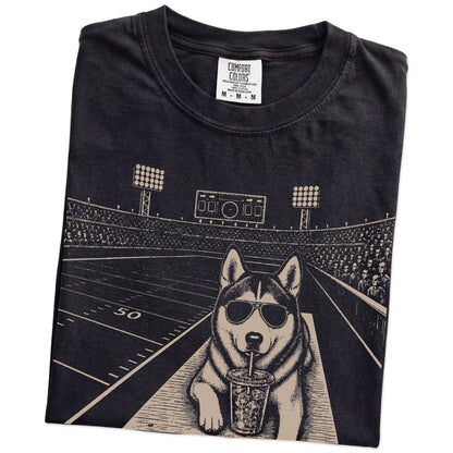 Folded Black Comfort Colors® T-shirt showing Husky ready for football and tailgate season