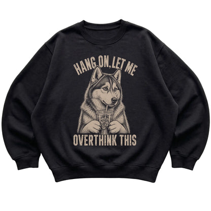 Black crewneck sweatshirt featuring Overthinking Husky, laid-flat presentation