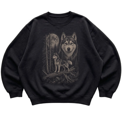 Husky Moonlit Forest graphic on a black crewneck sweatshirt laid flat