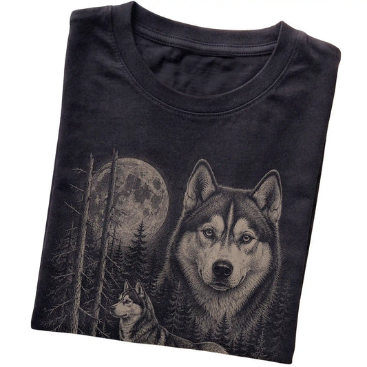 Folded black Softstyle T-shirt showing the Husky Moonlit Forest graphic