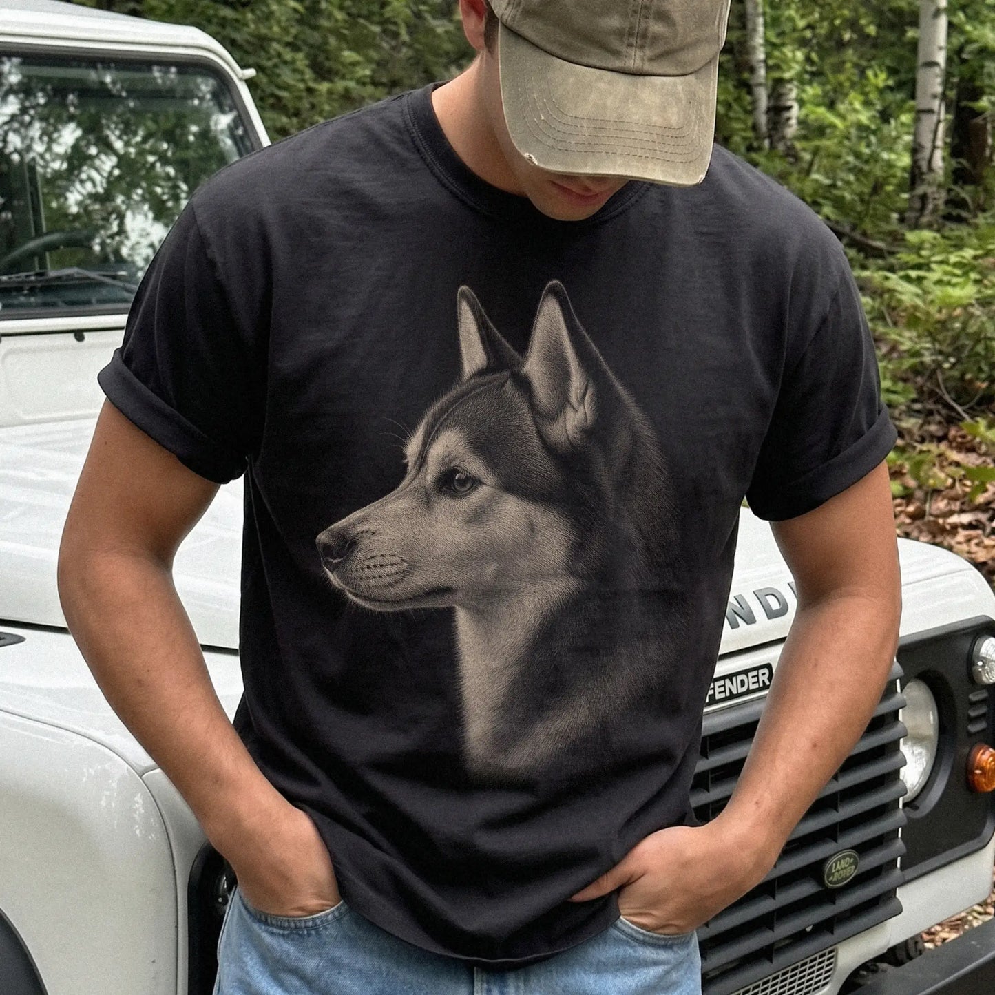 Model wearing a Black Comfort Colors® T-shirt with a detailed Husky portrait