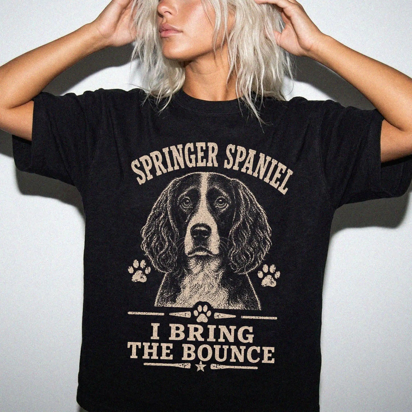 Model wearing a Black Comfort Colors® T-shirt featuring Springer Spaniel design with “I Bring The Bounce” lettering