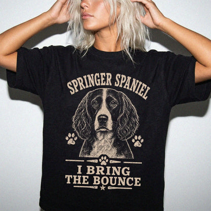 Model wearing a Black Comfort Colors® T-shirt featuring Springer Spaniel design with “I Bring The Bounce” lettering