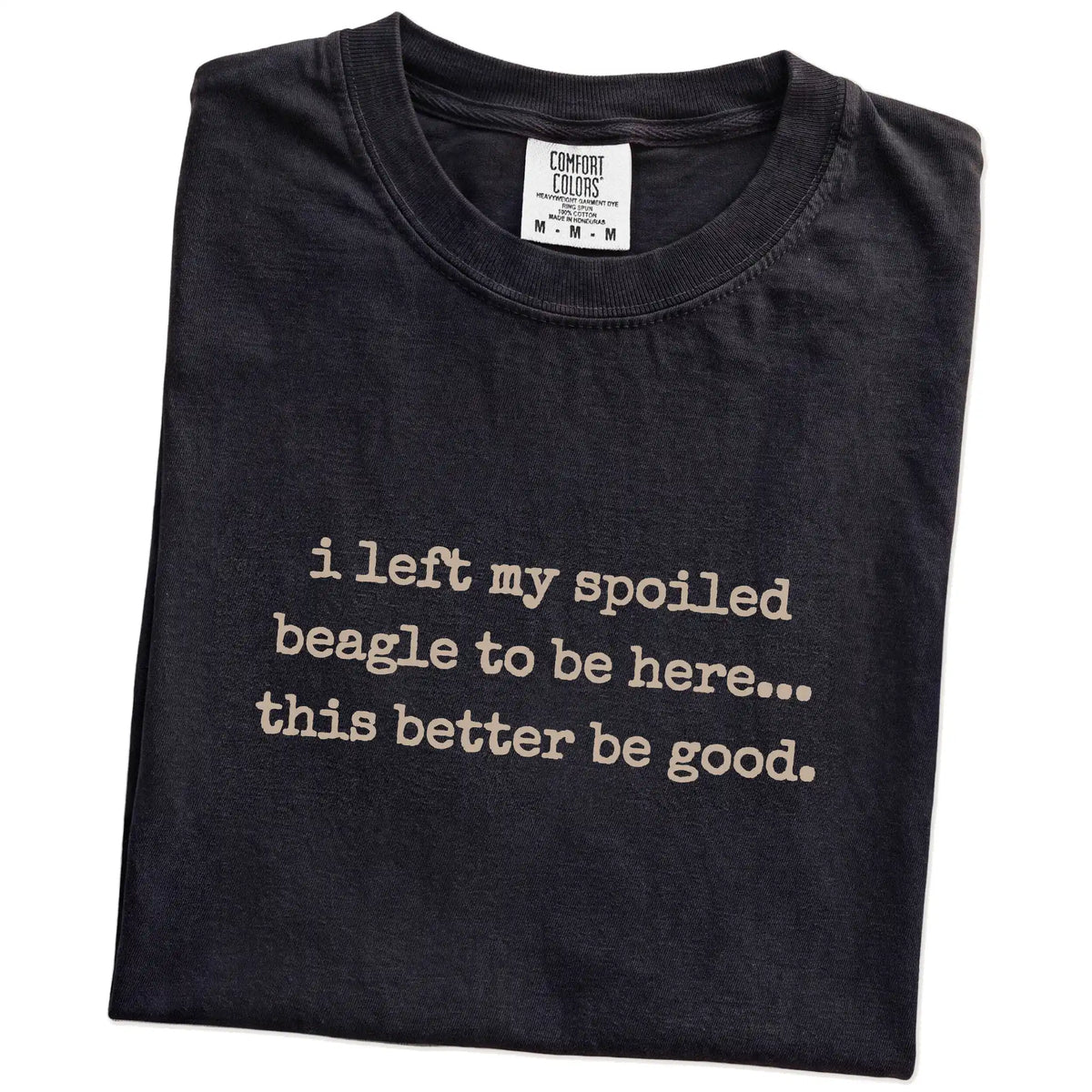Folded Black Comfort Colors® T-shirt showing the “I Left My Spoiled Beagle Home” saying