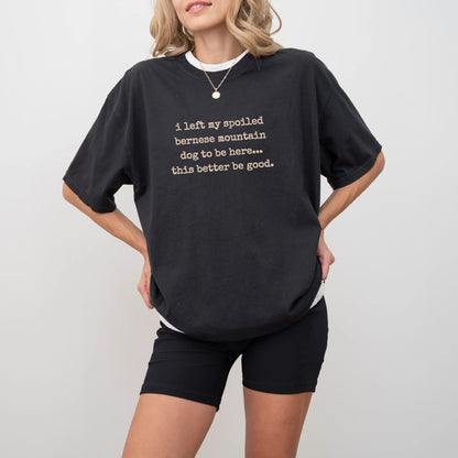 Model wearing a Black Comfort Colors® T-shirt featuring the “I Left My Spoiled Bernese Mountain Dog Home” saying