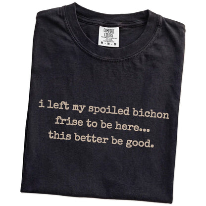 Folded Black Comfort Colors® T-shirt showing the “I Left My Spoiled Bichon Frise Home” saying