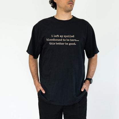 Model wearing a Black Comfort Colors® T-shirt featuring the “I Left My Spoiled Bloodhound Home” saying