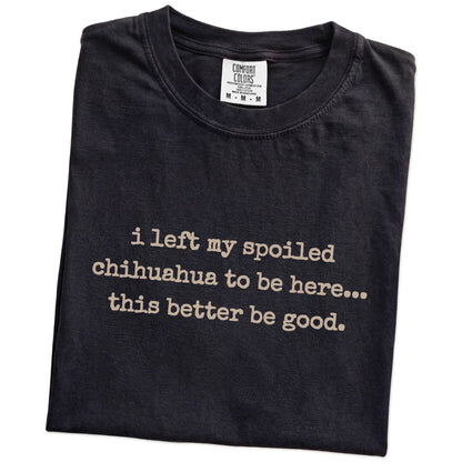 Folded Black Comfort Colors® T-shirt showing the “I Left My Spoiled Chihuahua Home” saying