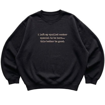 Black I Left My Spoiled Cocker Spaniel sweatshirt laid flat