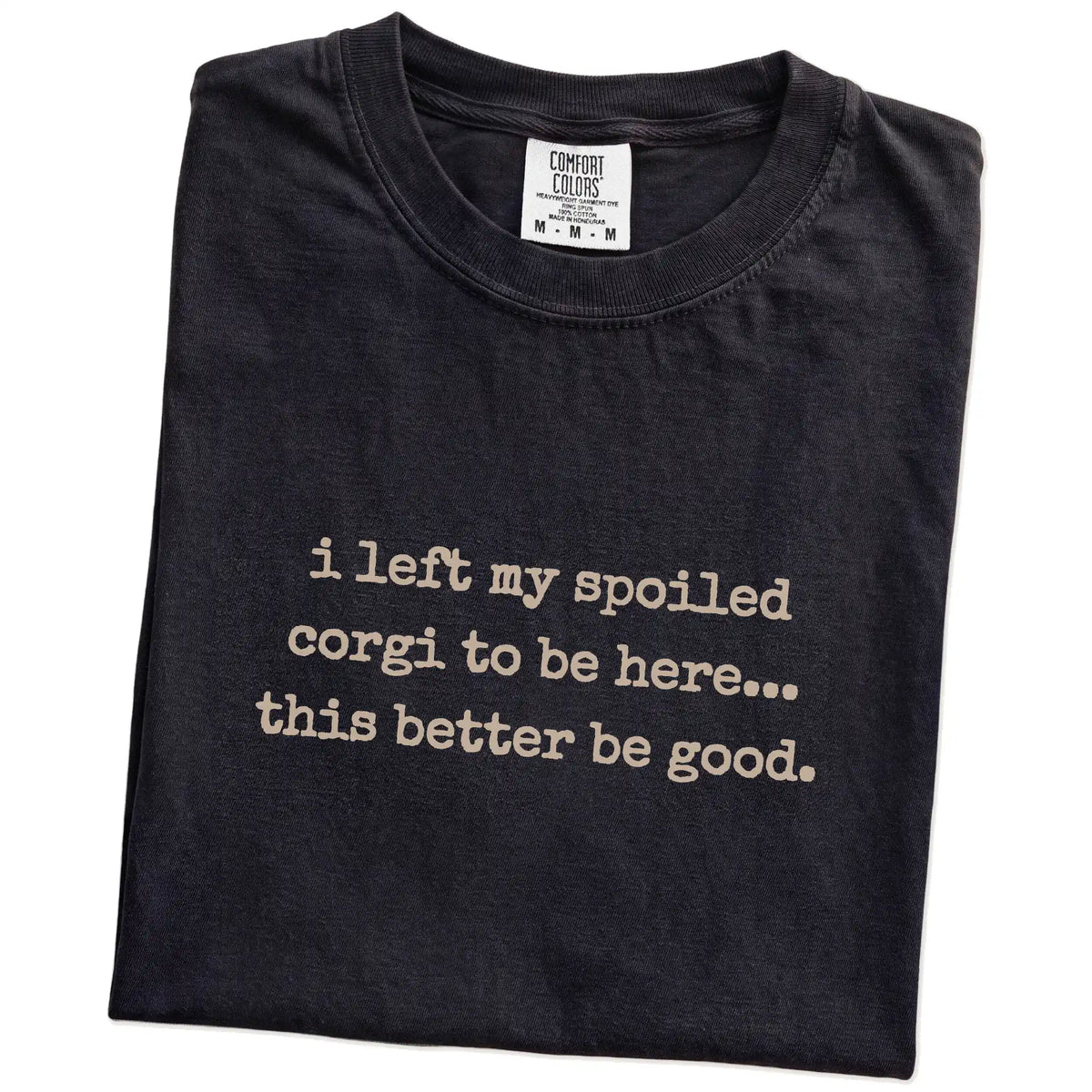 Folded Black Comfort Colors® T-shirt showing the “I Left My Spoiled Corgi Home” saying