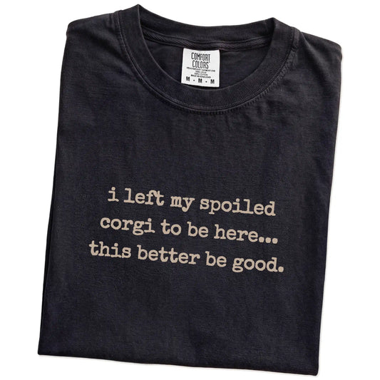 Folded Black Comfort Colors® T-shirt showing the “I Left My Spoiled Corgi Home” saying