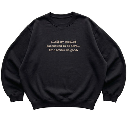 Black I Left My Spoiled Dachshund sweatshirt laid flat
