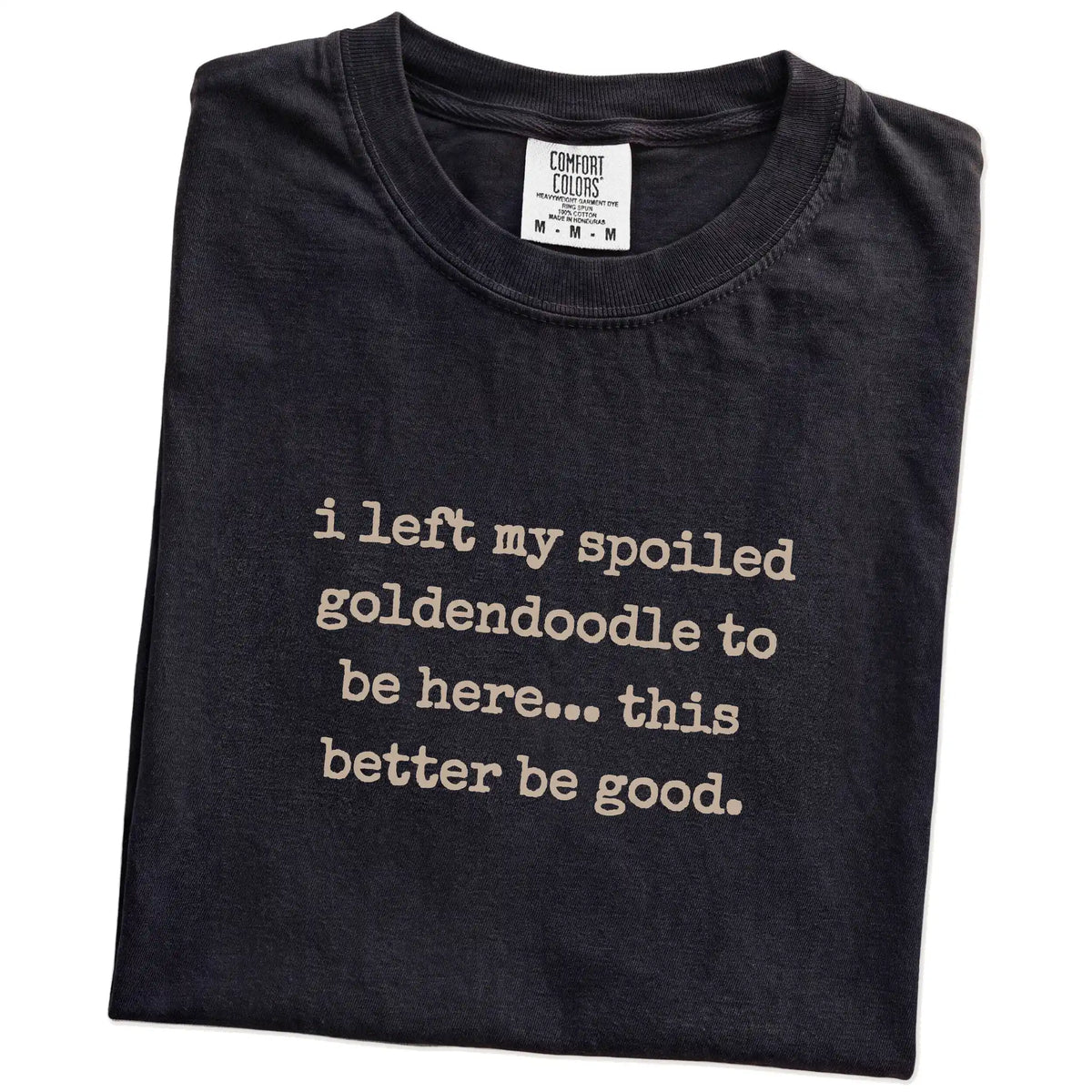 Folded Black Comfort Colors® T-shirt showing Goldendoodle “I Left My Spoiled Dog Home” saying