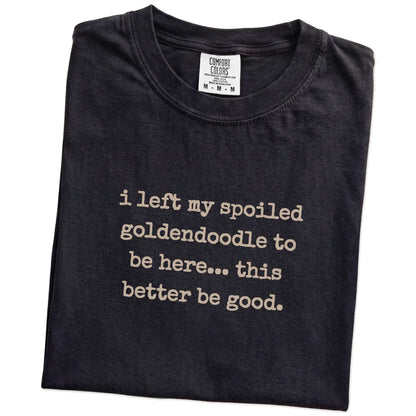 Folded Black Comfort Colors® T-shirt showing Goldendoodle “I Left My Spoiled Dog Home” saying