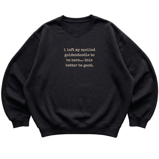 Black I Left My Spoiled Goldendoodle sweatshirt laid flat