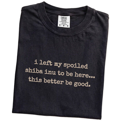 Folded Black Comfort Colors® T-shirt showing the “I Left My Spoiled Shiba Inu Home” saying