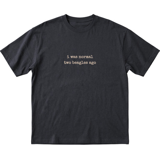 Black I Was Normal Two Beagles Ago T-shirt laid flat