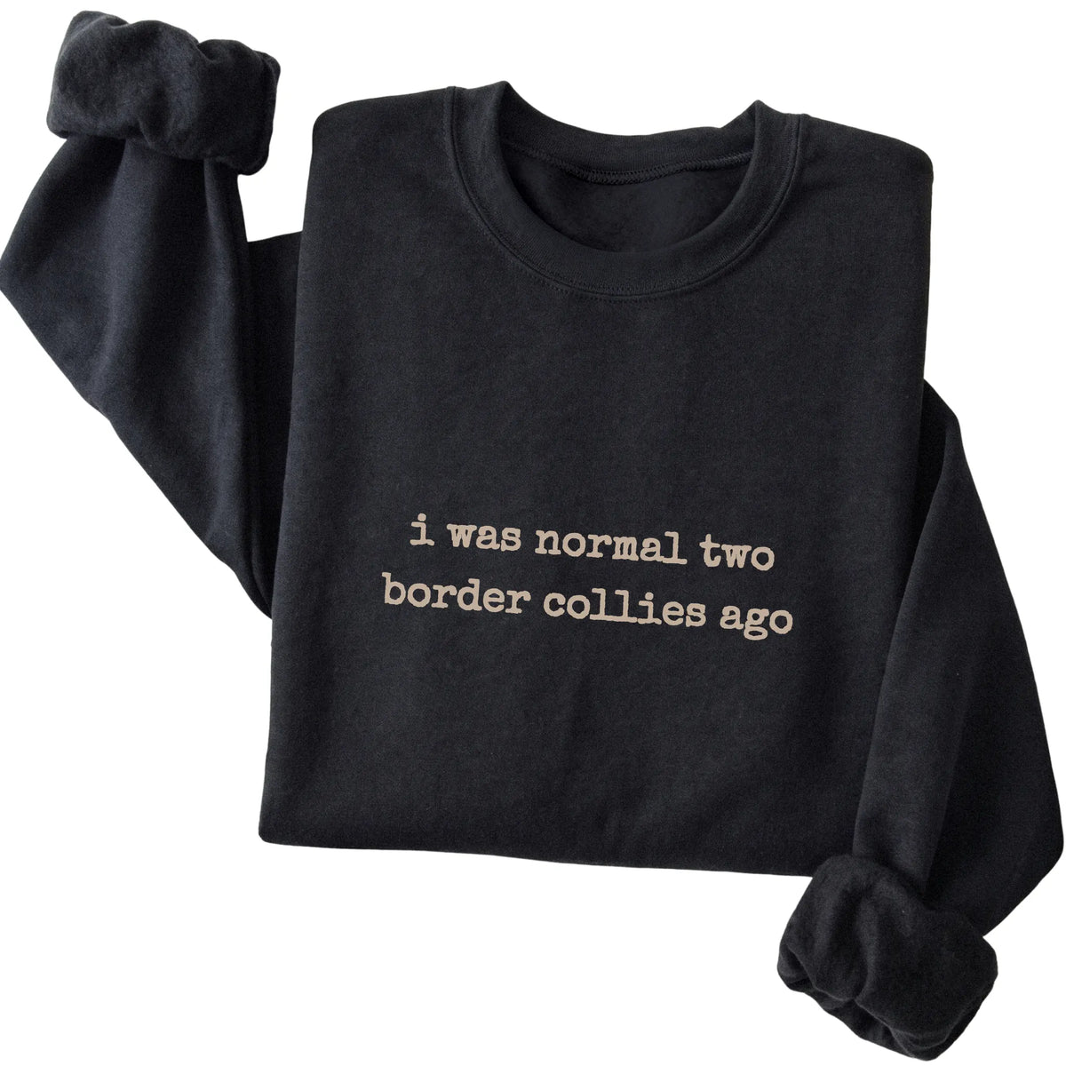 Black I Was Normal Two Border Collies Ago sweatshirt folded to show the printed design