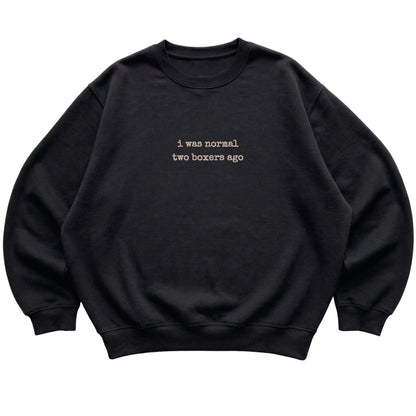 Black I Was Normal Two Boxers Ago sweatshirt laid flat
