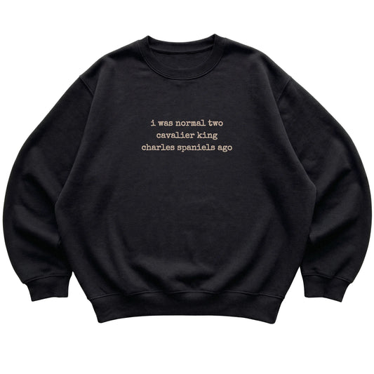 Black I Was Normal Two Cavalier King Charles Spaniels Ago sweatshirt laid flat