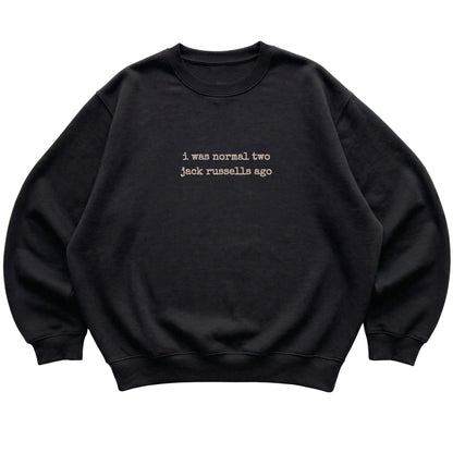 Black I Was Normal Two Jack Russells Ago sweatshirt laid flat