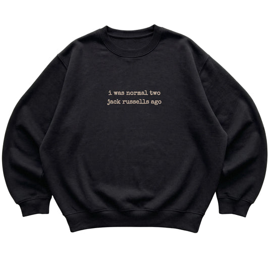 Black I Was Normal Two Jack Russells Ago sweatshirt laid flat