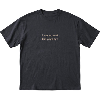 Black I Was Normal Two Pugs Ago T-shirt laid flat