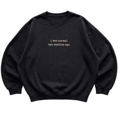 Black I Was Normal Two Westies Ago sweatshirt laid flat
