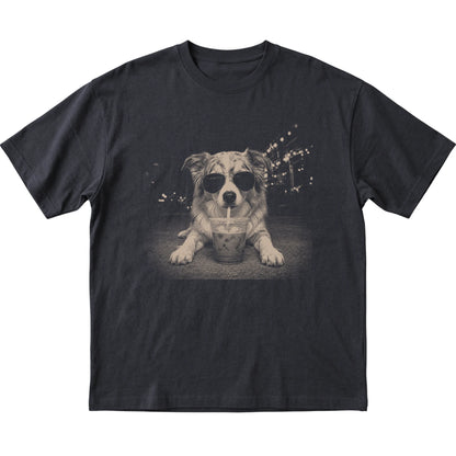 Australian Shepherd wearing aviator sunglasses and drinking iced coffee on a Black Gildan Softstyle T-Shirt, flat lay view