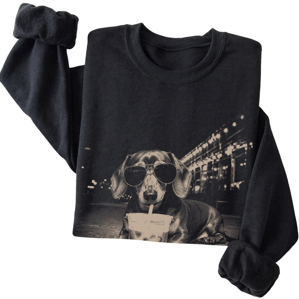 Dachshund wearing aviator sunglasses and drinking iced coffee on a Black Gildan Heavy Blend Crewneck Sweatshirt, folded view