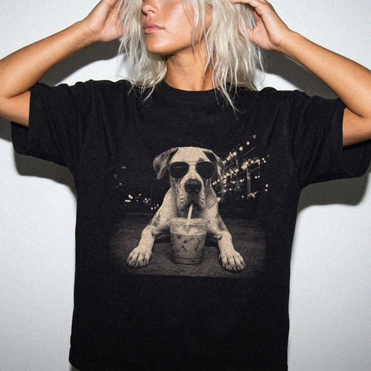 Model wearing a Black Comfort Colors® T-shirt featuring Great Dane with iced coffee in a retro grunge design