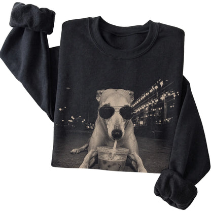 Greyhound wearing aviator sunglasses and drinking iced coffee on a Black Gildan Heavy Blend Crewneck Sweatshirt, folded view