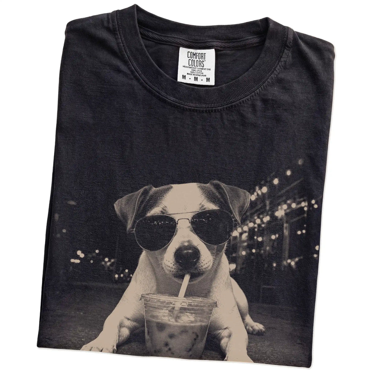 Folded Black Comfort Colors® T-shirt showing Jack Russell with iced coffee in a retro grunge design