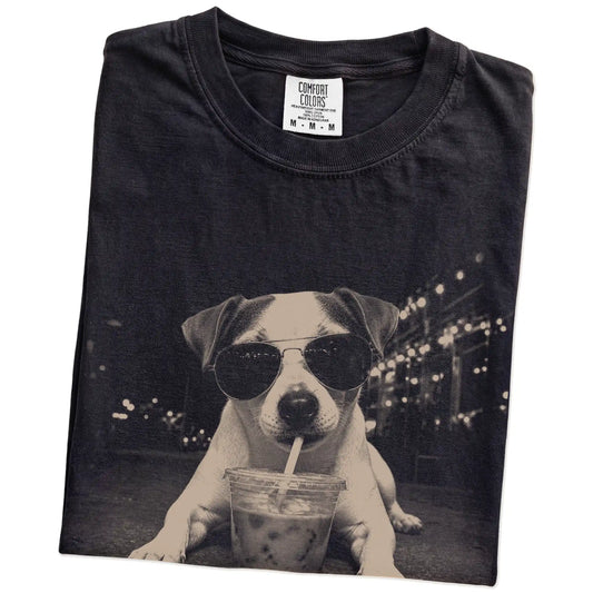Folded Black Comfort Colors® T-shirt showing Jack Russell with iced coffee in a retro grunge design