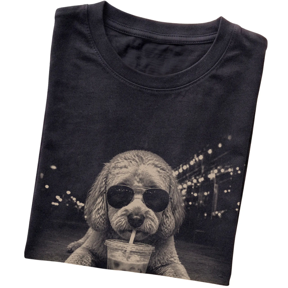 Labradoodle wearing aviator sunglasses and drinking iced coffee on a Black Gildan Softstyle T-Shirt, folded view