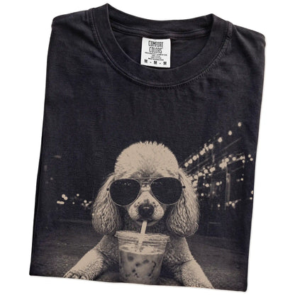 Folded Black Comfort Colors® T-shirt showing Poodle with iced coffee in a retro grunge design