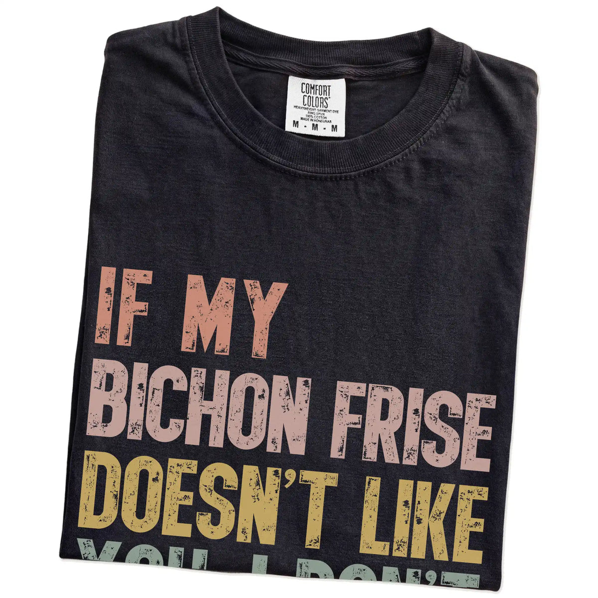 Folded Black Comfort Colors® T-shirt showing Bichon Frise with “If My Dog Doesn’t Like You, I Don’t Either” lettering