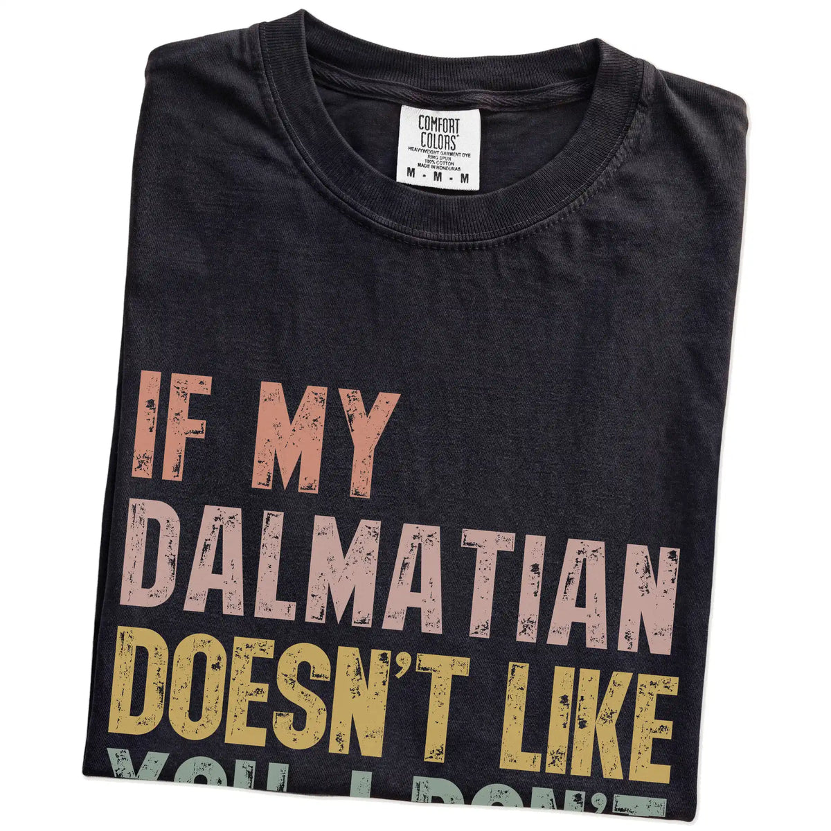 Folded Black Comfort Colors® T-shirt showing Dalmatian with “If My Dog Doesn’t Like You, I Don’t Either” lettering