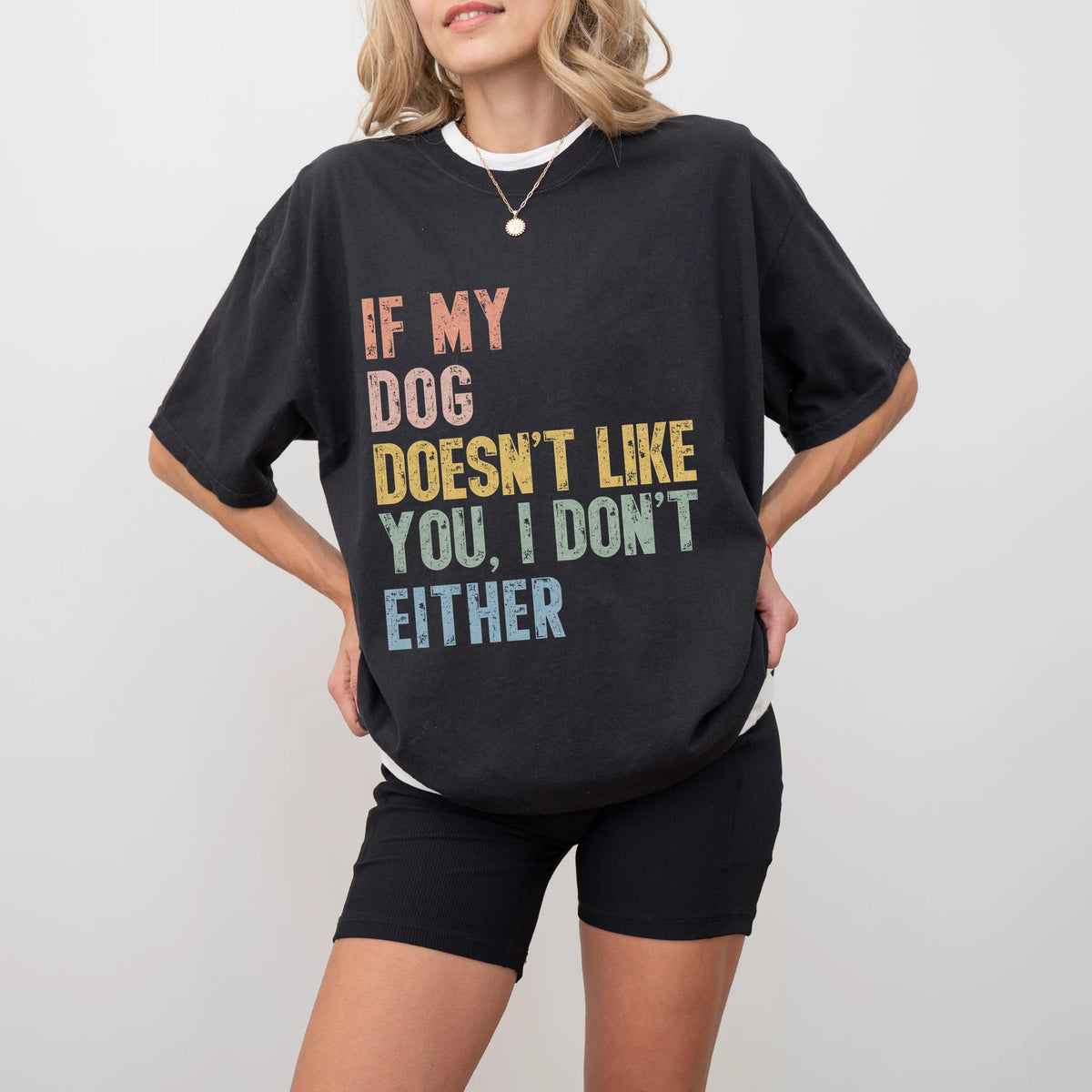 Model wearing a Black Comfort Colors® T-shirt featuring dogs with “If My Dog Doesn’t Like You, I Don’t Either” lettering