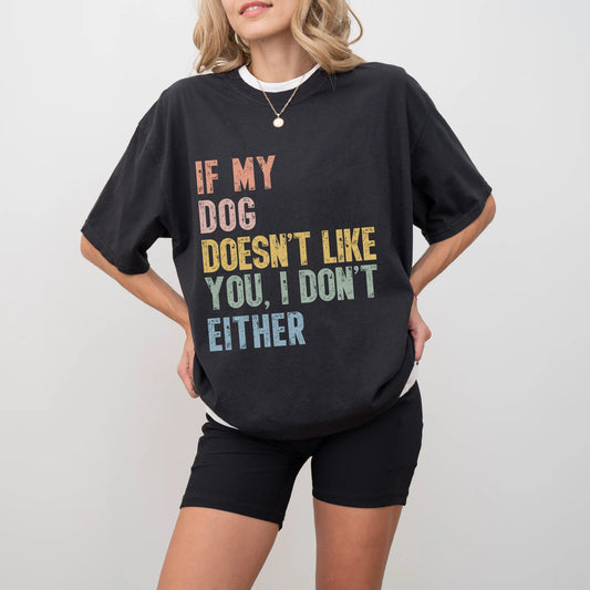 Model wearing a Black Comfort Colors® T-shirt featuring dogs with “If My Dog Doesn’t Like You, I Don’t Either” lettering