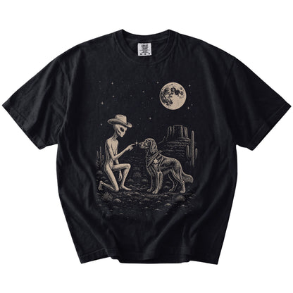Cowboy alien fist-bumping a Irish Setter beneath the moon on a Black Comfort Colors® T-shirt