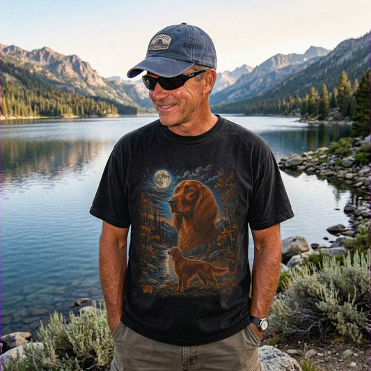 Model wearing a Black Comfort Colors® t-shirt featuring Irish Setter in a moonlit fall forest