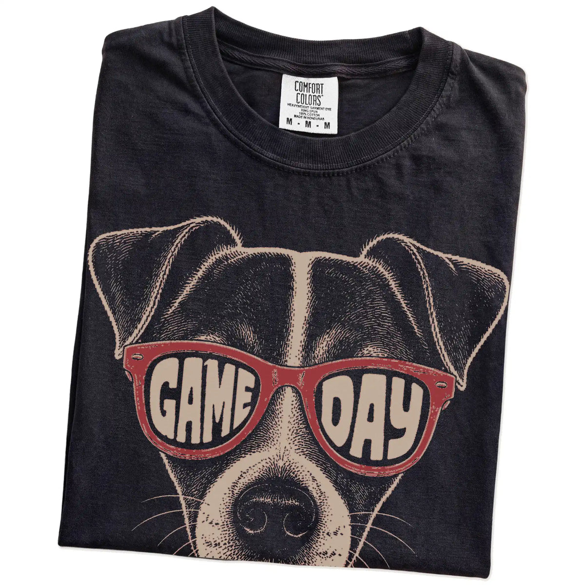 Folded Black Comfort Colors® T-shirt showing jack russell wearing red game day sunglasses