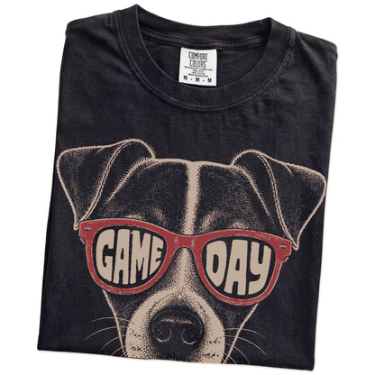 Folded Black Comfort Colors® T-shirt showing jack russell wearing red game day sunglasses