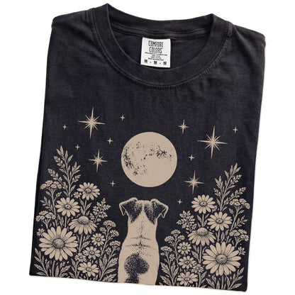 Folded Black Comfort Colors® T-shirt showing Jack Russell beneath a wildflower moon