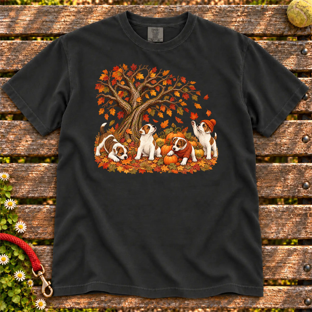Four Jack Russell puppies with pumpkins beneath an autumn tree on a Black garment-dyed T-shirt